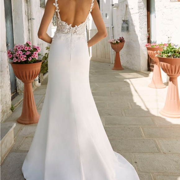 Never worn or altered wedding dress, size 12 but fits a size 4 jeans well. - Picture 5 of 6